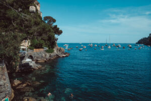 The Italian Riviera with blue waters and boats. Photo by Lucera Studio, a creative marketing studio in Grand Rapids, Michigan.